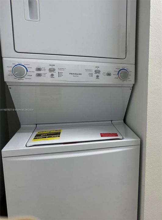 Brand new stackable washer & dryer.