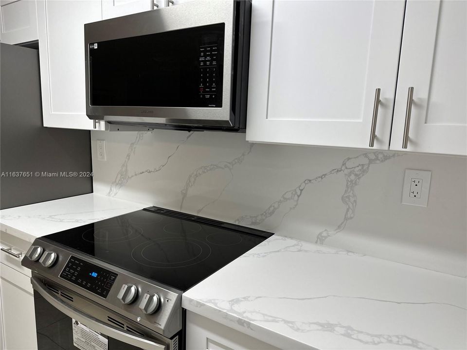 Brand new kitchen - marble counter tops, cabinets, & stainless steel appliances.