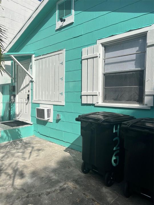 Front of 3 bedroom house with working wood shutters