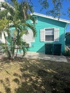 Front of 3 bedroom house with concrete patio