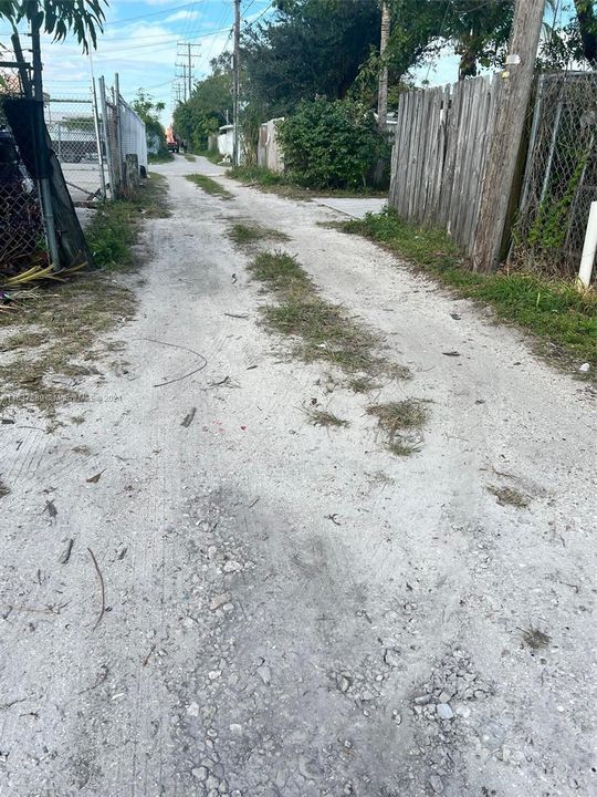 Alley access to private entrance and parking area of 1 bedroom house