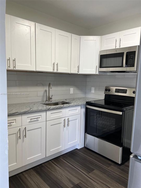 Closer view of new cabinet and appliances in 1 bedroom house