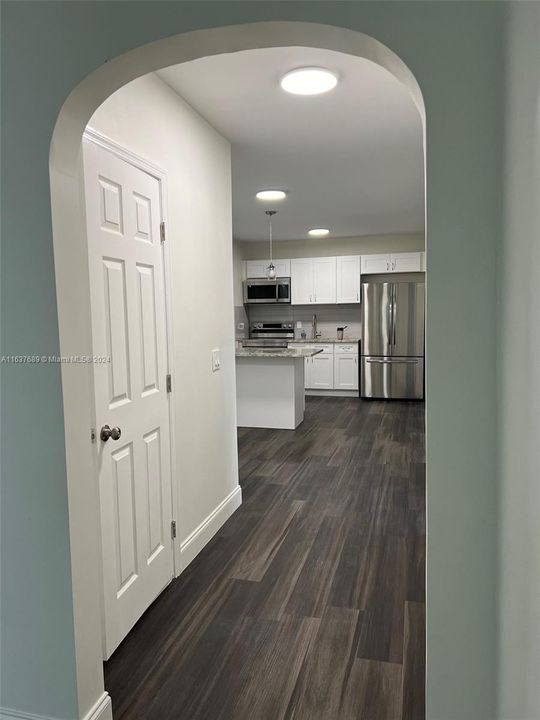 Hallway to bath, kitchen, bedrooms