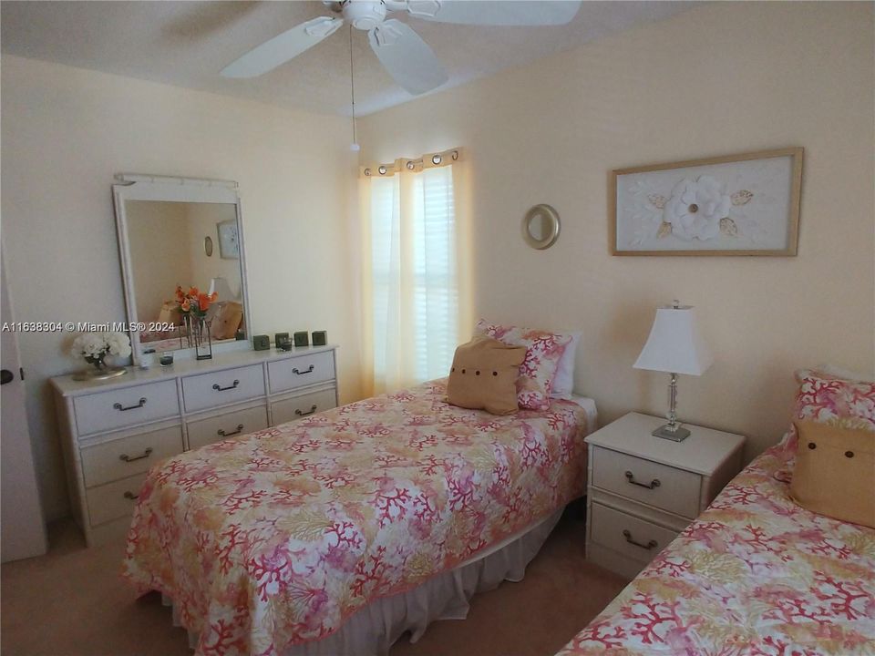 Sunny guest room 2 windows large walk in closets.