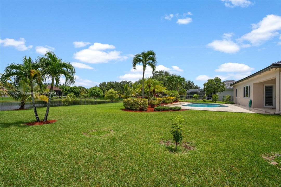 SIDE VIEW OF POOL AND GARDEN