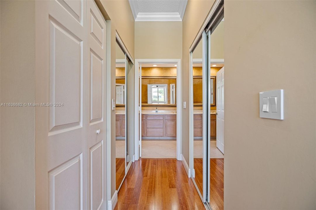 MASTER BEDROOM TWO WALKIN COSETS & BATHROOM FOYER ENTRY