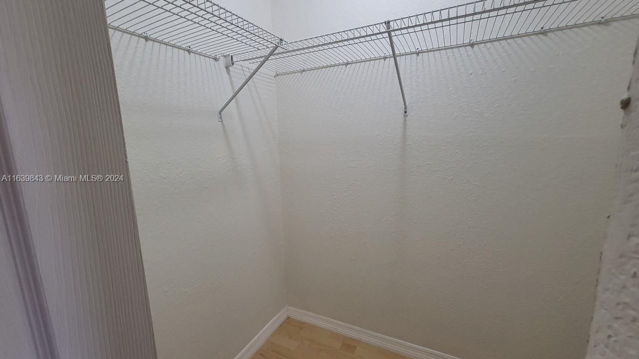 Tons of space in dual walk-in closets.