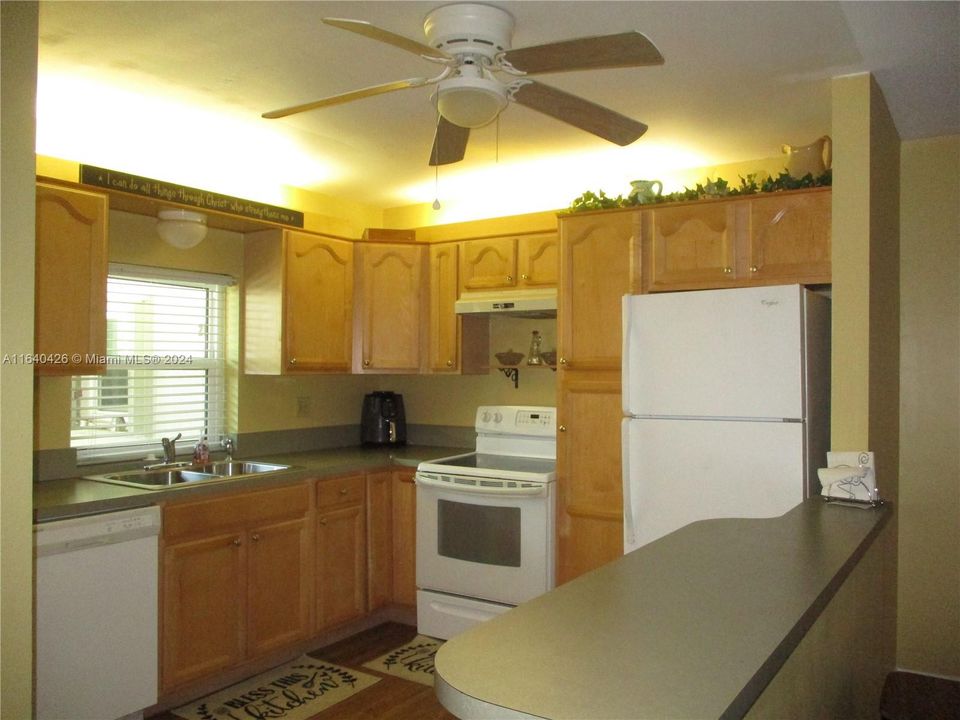 KITCHEN WITH LIGHTS ABOVE THE CABINETS.