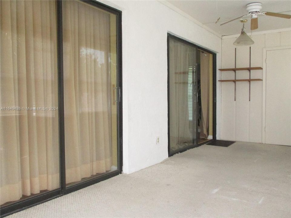 TWO SLIDING DOORS FROM PATIO INTO MASTER BEDROOM & LIVING AREA