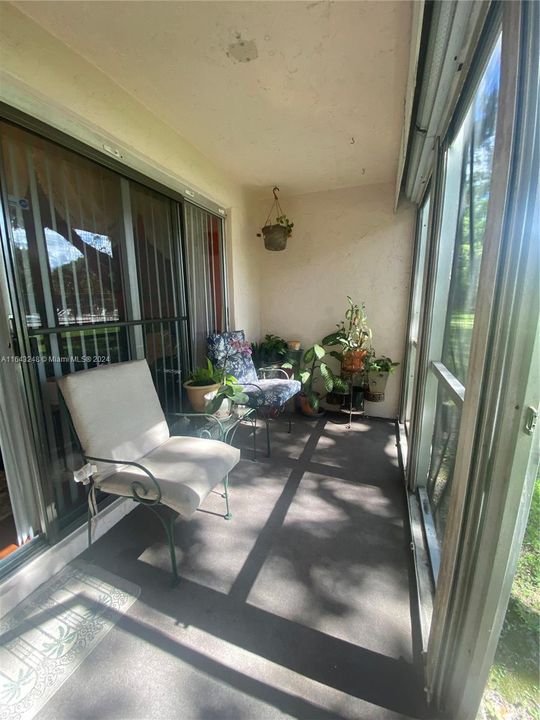Screened in Patio w/ rolled down Shutters