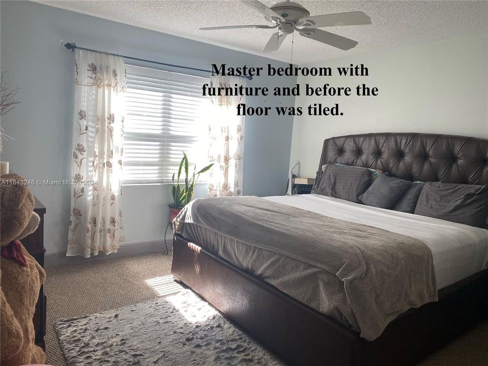 Bedroom bedroom with furniture and before it was tiled.