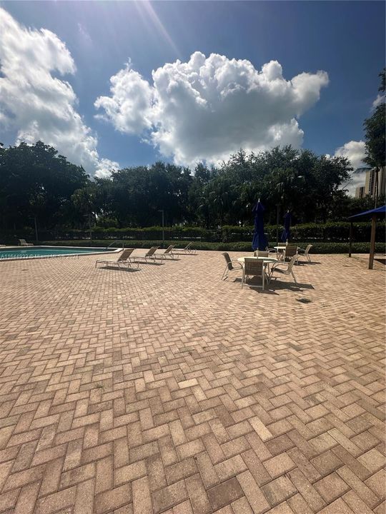 POOL DECK AREA WITH TABLE & CHAIRS