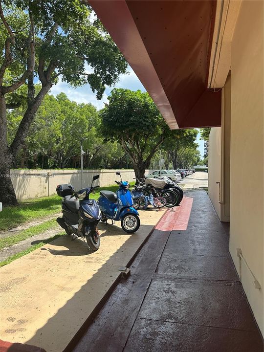 BICYCLE AND MOPED PARKING BEHIND CLUBHOUSE