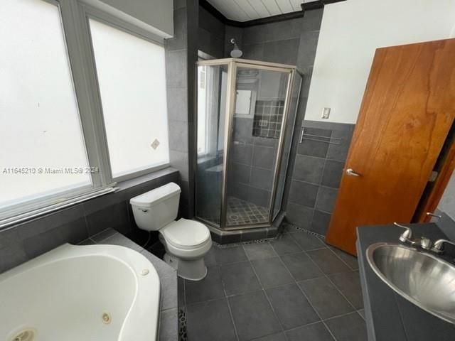 Master bathroom with tub and shower