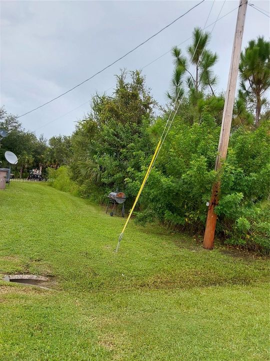 Land Depth see from left side,  lot is located to the  right  of the light orange pole.