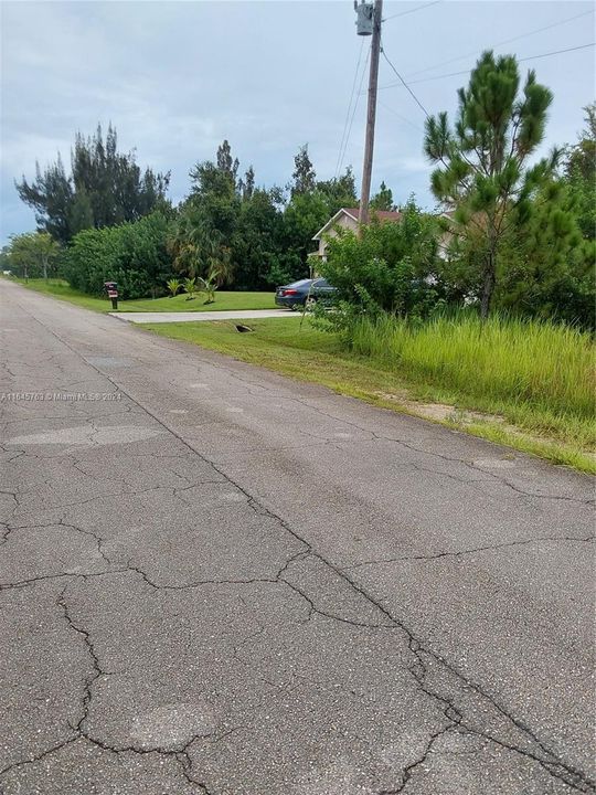 The house located next to the vacant lot is fully built.