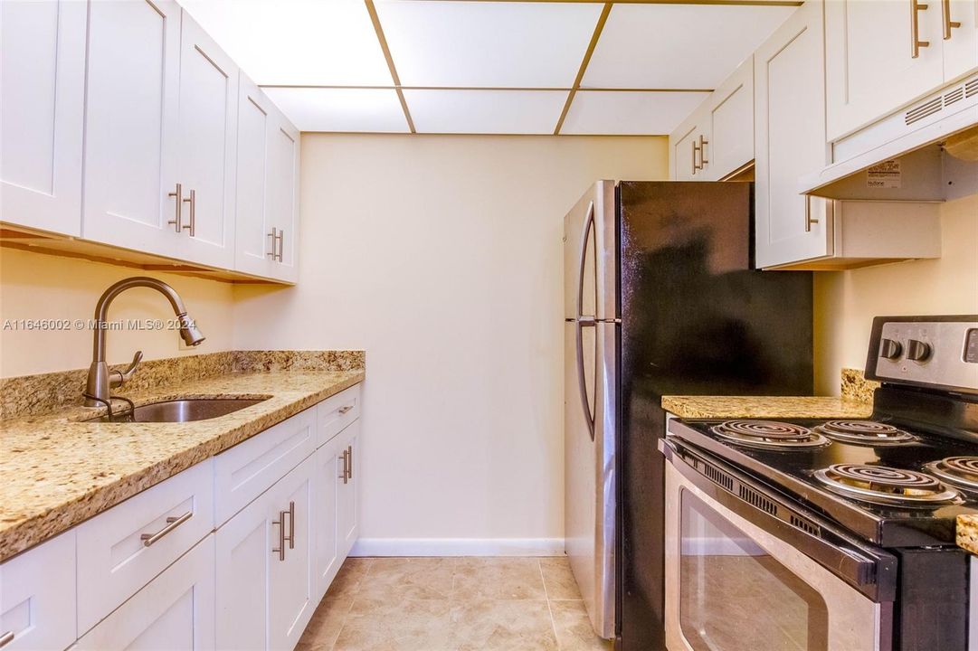 updated kitchen cabinets and granite countertops