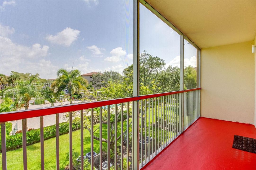 screened in balcony with pool views