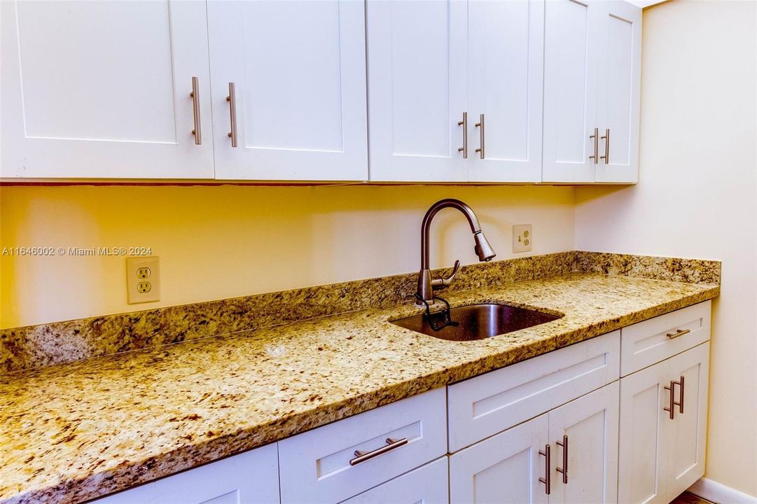 updated kitchen cabinets and granite countertops