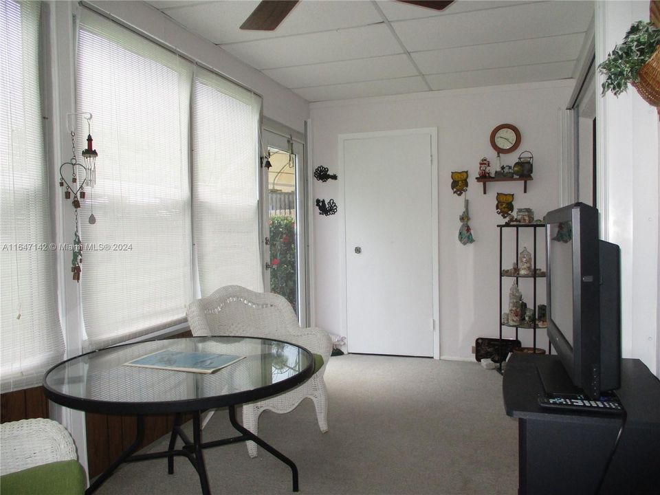 ENCLOSED PATIO WITH STORAGE ROOM BY BACK DOOR