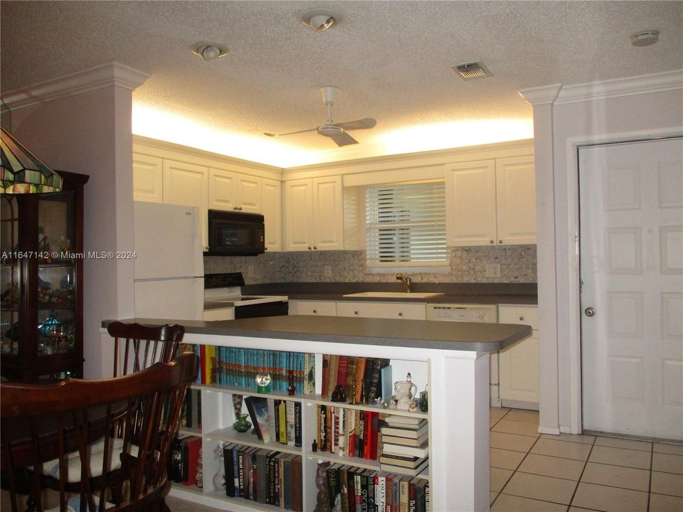 TWO STOOLS FOR BREAKFAST WITH ADDED STORAGE BY DINING AREA