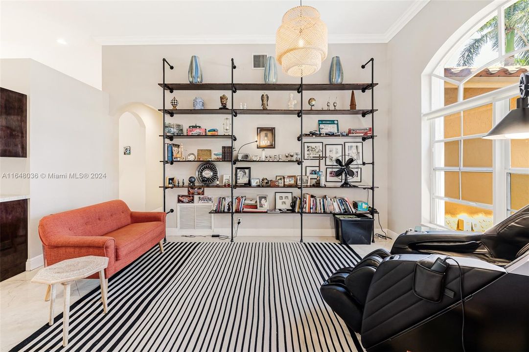 Dinning room area is being used as a library or sitting room.