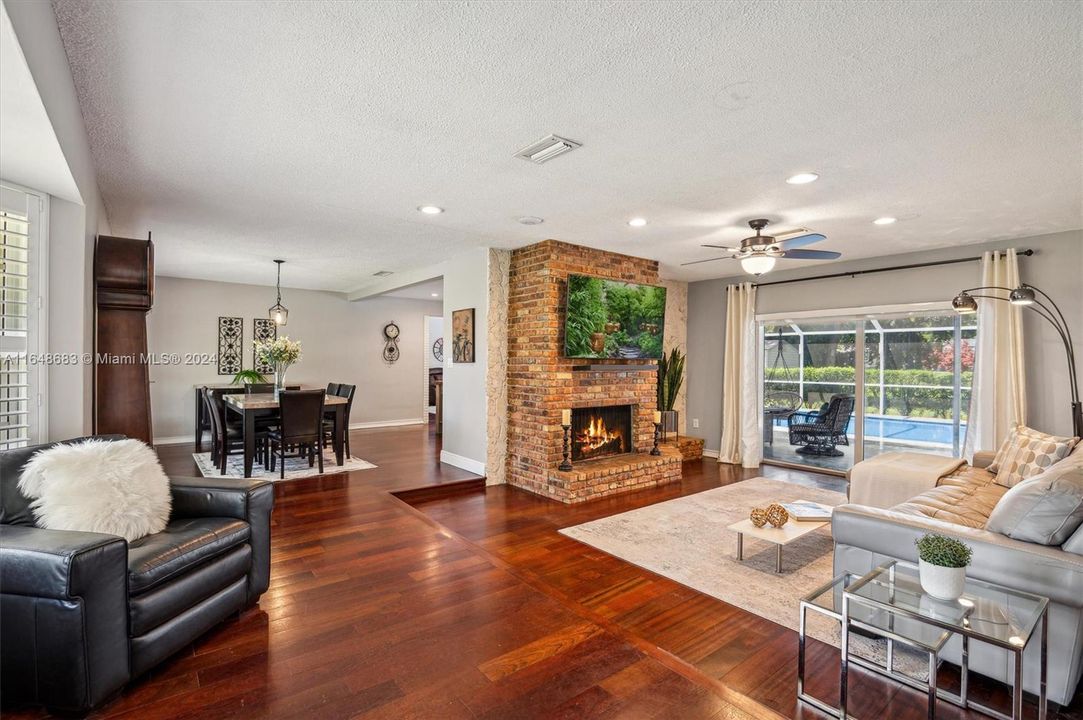 Open floor plan with hard wood floors throughout