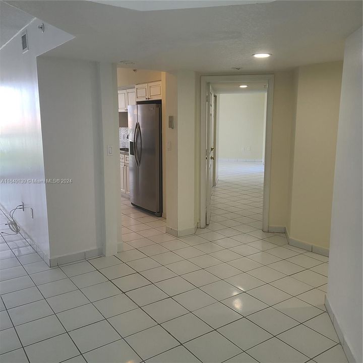 Hallway to bedrooms and kitchen