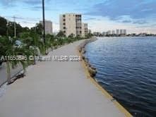 Walking path around the entire Point East complex surrounded by water