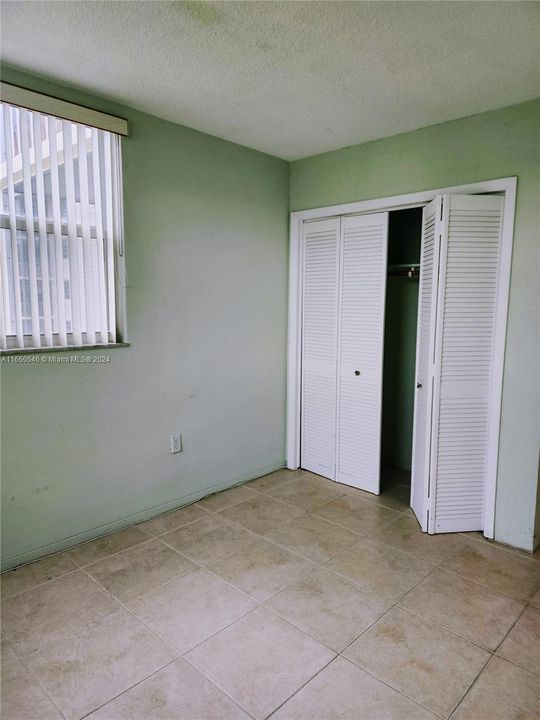 Bedroom 2 with wall closet. Perfect for couple who sleeps separately.