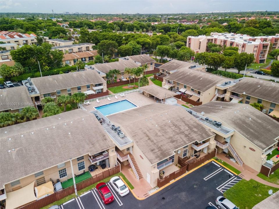 Community pool behind unit