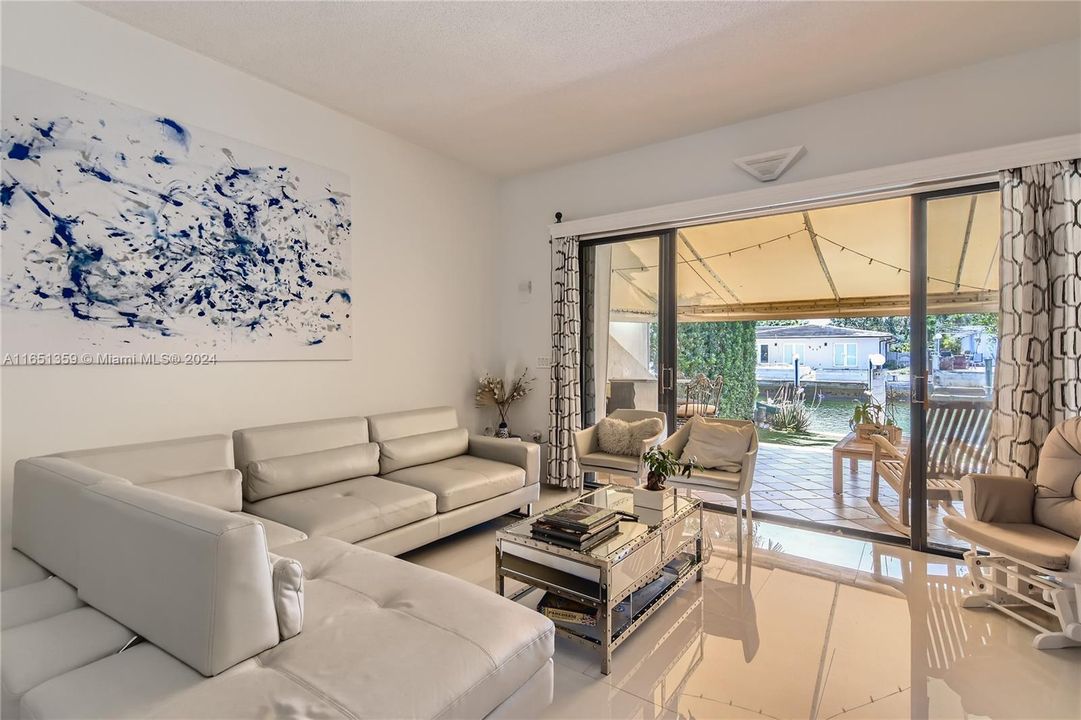 Spacious living room with lots of natural light coming in.