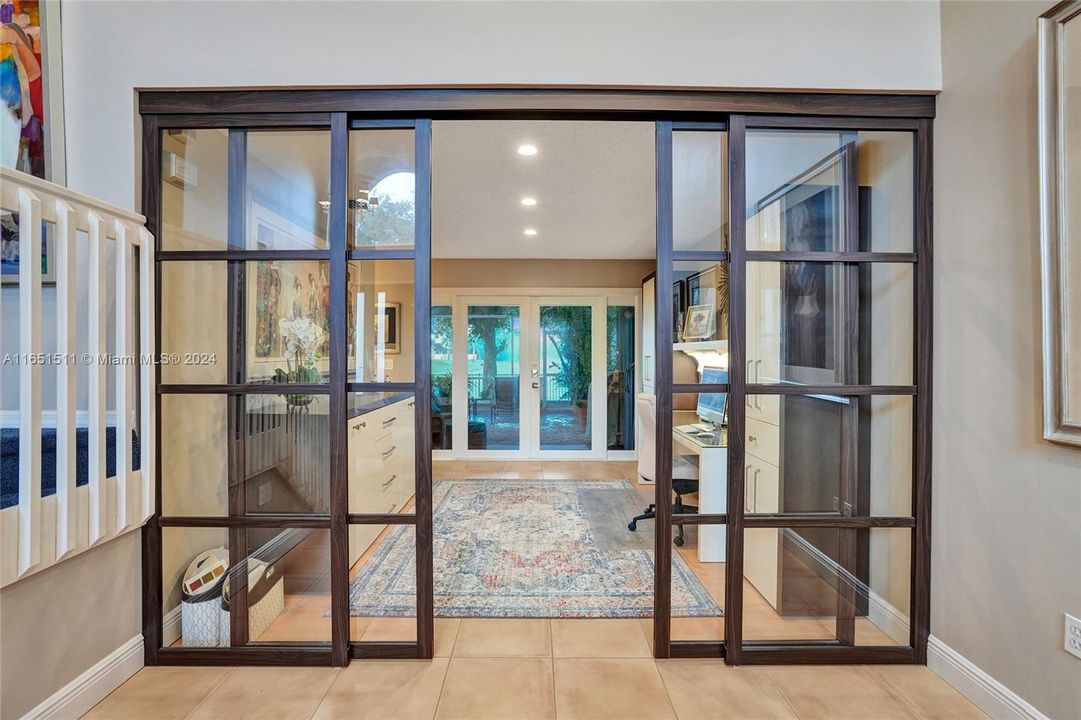 Glass Door Sliders separate the formal dining room that is used as an office!