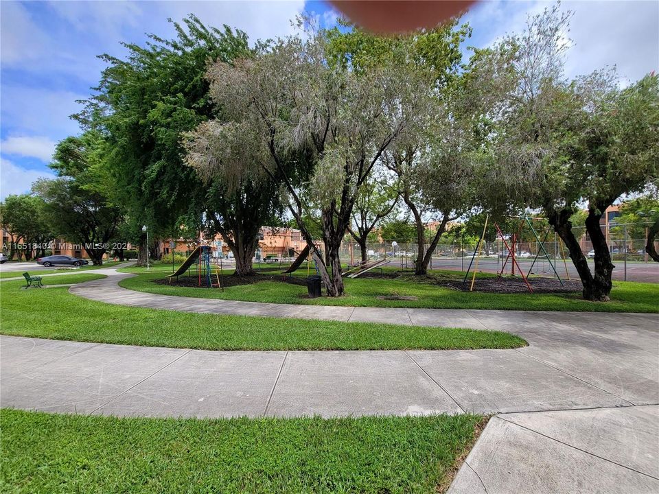 CHILD PLAY GROUND NEXT TO TENNIS COURTS