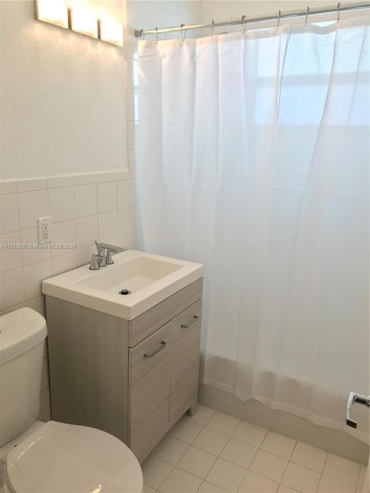 Bathroom w/ new toilette and vanity