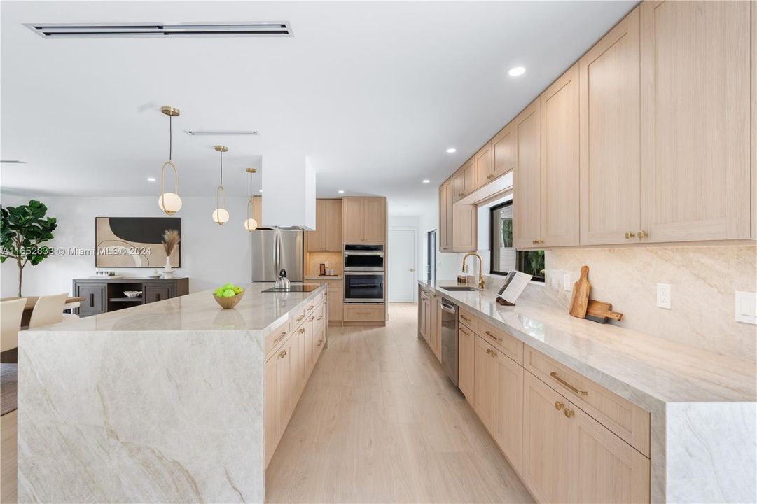 Beautiful white oak cabinets with quartzite Tajmahal counter tops