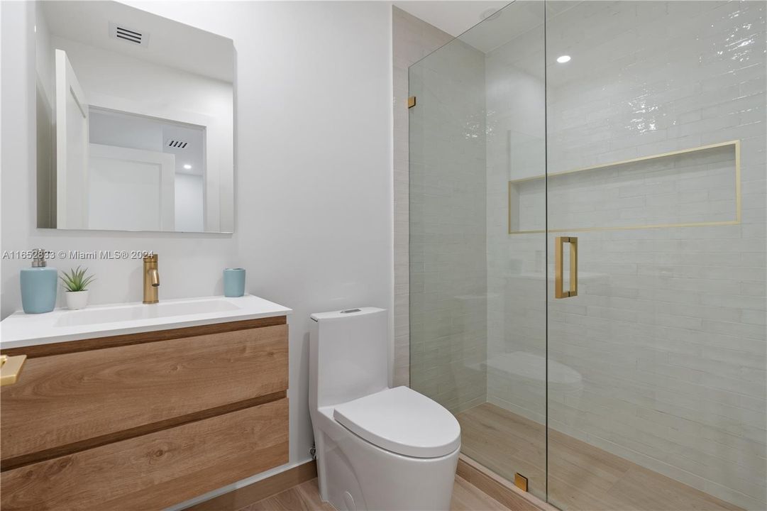 3 bedroom on suite with European cabinets and gorgeous designer tile shower