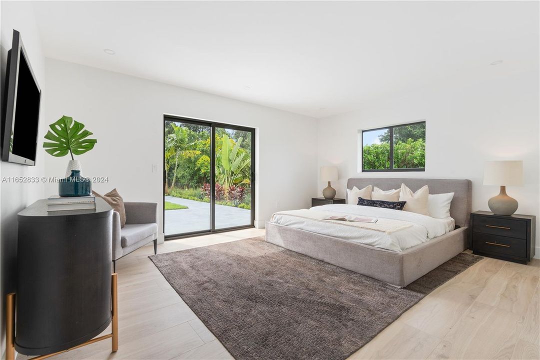 master bedroom  with his and her closets and on suite