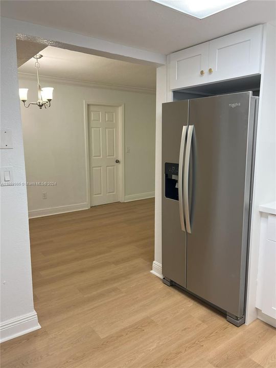 View of Primary bedroom door from Kitchen