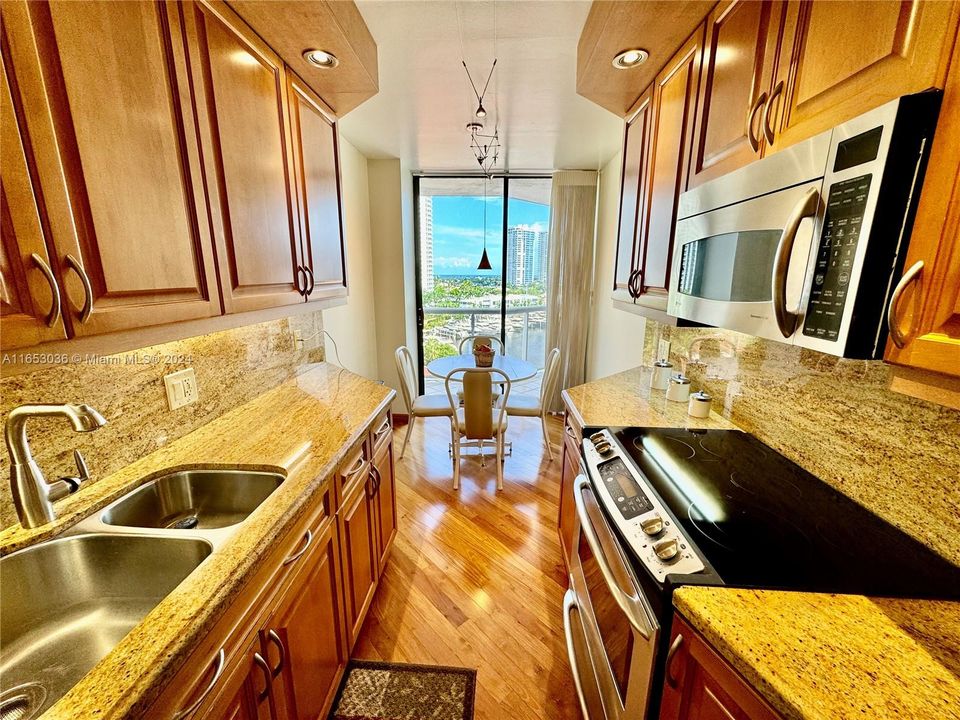 NEW CUSTOM DESIGNER SOLID CHERRY WOOD & CORSICAN GRANITE KITCHEN WITH CUSTOM BACKLIT AND CEILING "LED" LIGHTING