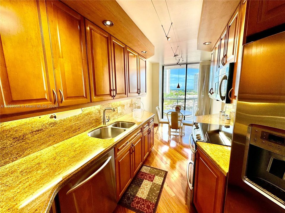 NEW CUSTOM DESIGNER SOLID CHERRY WOOD & CORSICAN GRANITE KITCHEN WITH CUSTOM BACKLIT AND CEILING "LED" LIGHTING