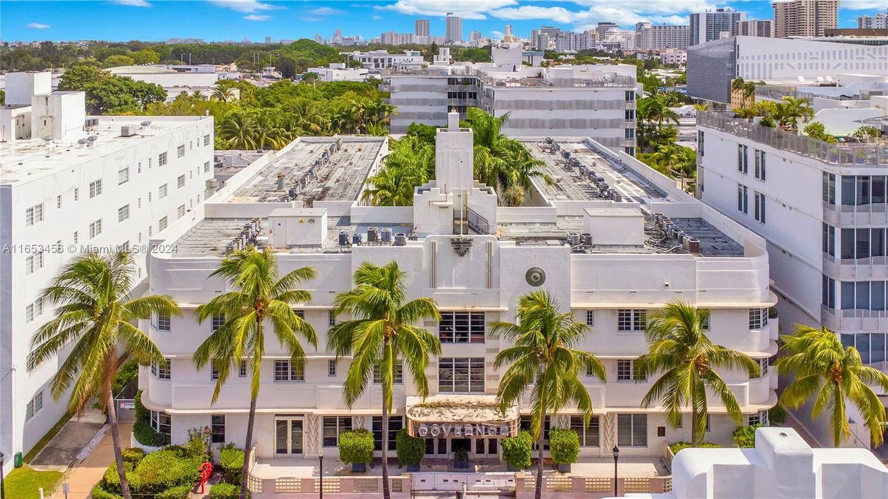 Stunning aerial view showcasing the resort-style building, lush courtyards, and surrounding Miami Beach landmarks.