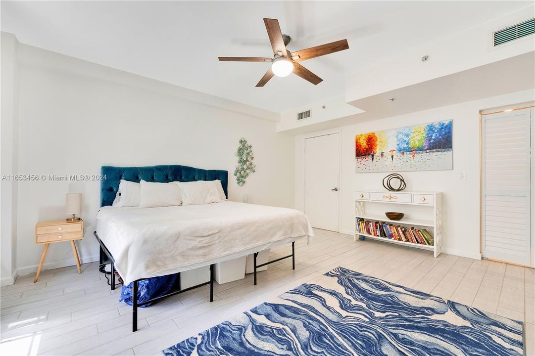 Large, sunlit bedroom with Eastern exposure, featuring a walk-in closet that provides ample storage.