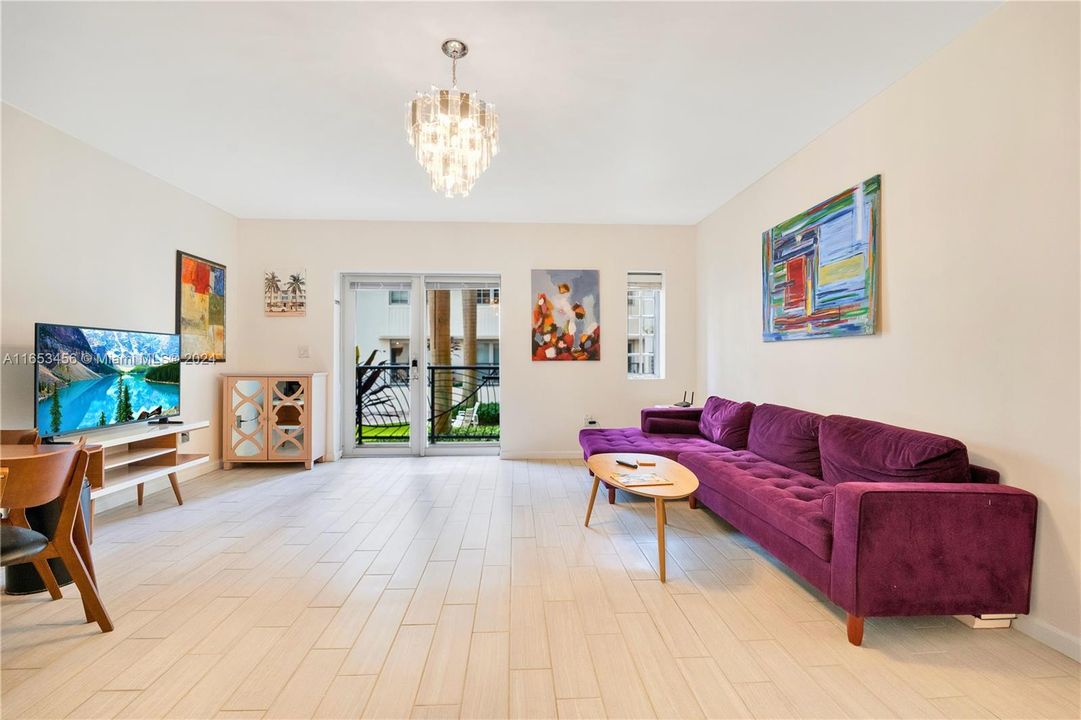 living area offers a perfect spot for relaxation with a view of the Art Deco Fountain and courtyard.