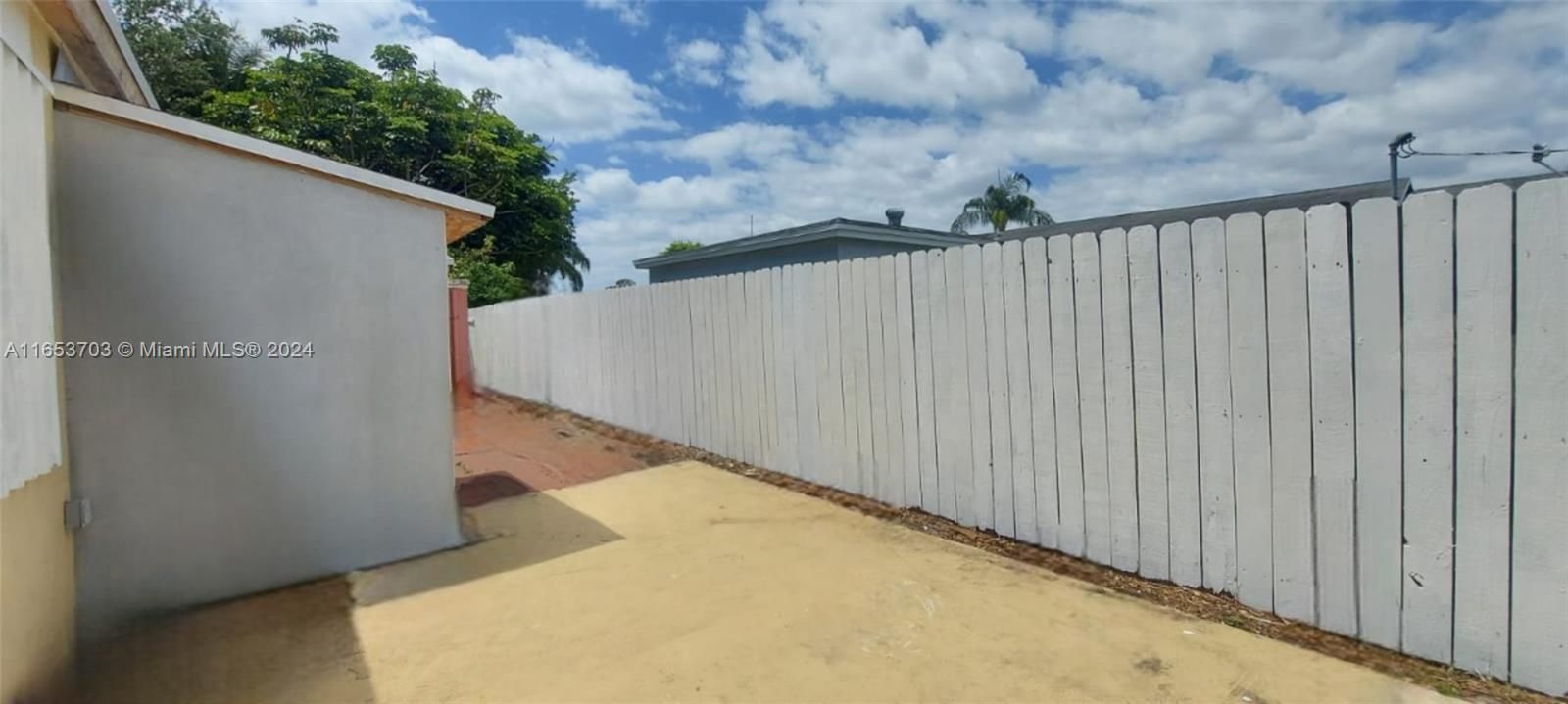 Backyard, other side view with storage shed