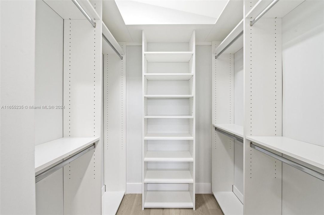 Master walk-in closet with custom designed built-in's.