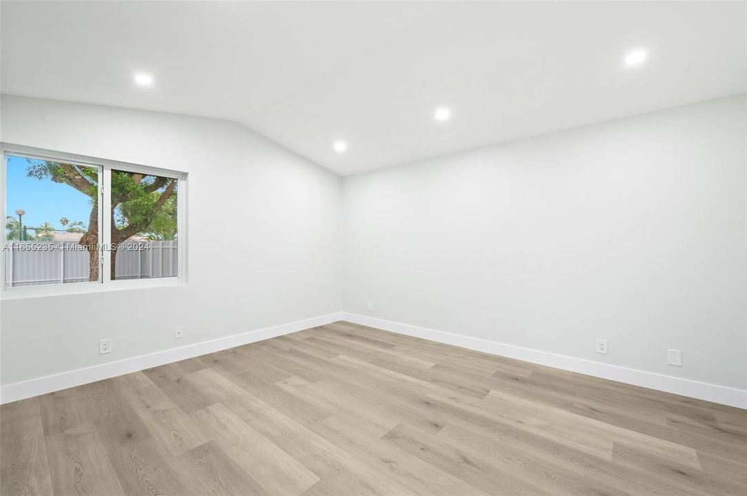 Master bedroom w/vaulted ceiling & LED lighting