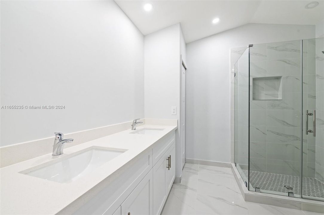 Master bath, framless shower enclosure, double sinks, 2 linen closets, LED lighting.