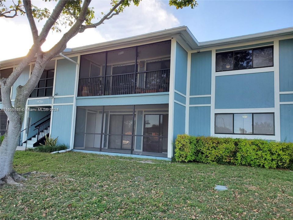 Second View of Front of Building showing Private Screened Patio