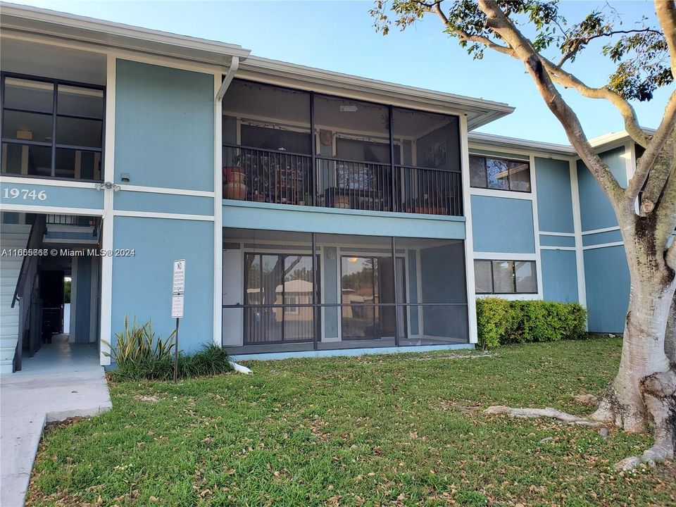 View of Front of Building showing Screened Private Patio